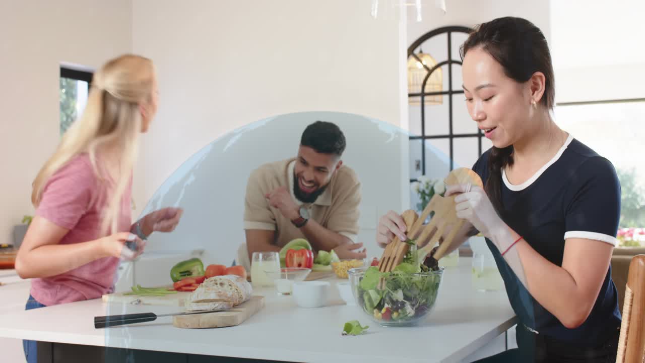 Pink woman chopping, man leaning, navy woman tossing salad, cooking, talking sparking digital globe