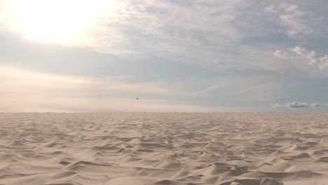 airplane flying over a desert landscape