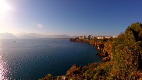 Park-rocks-timelapse-boats-sea-blue-sky