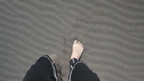 slow motion barefoot walking in the sand