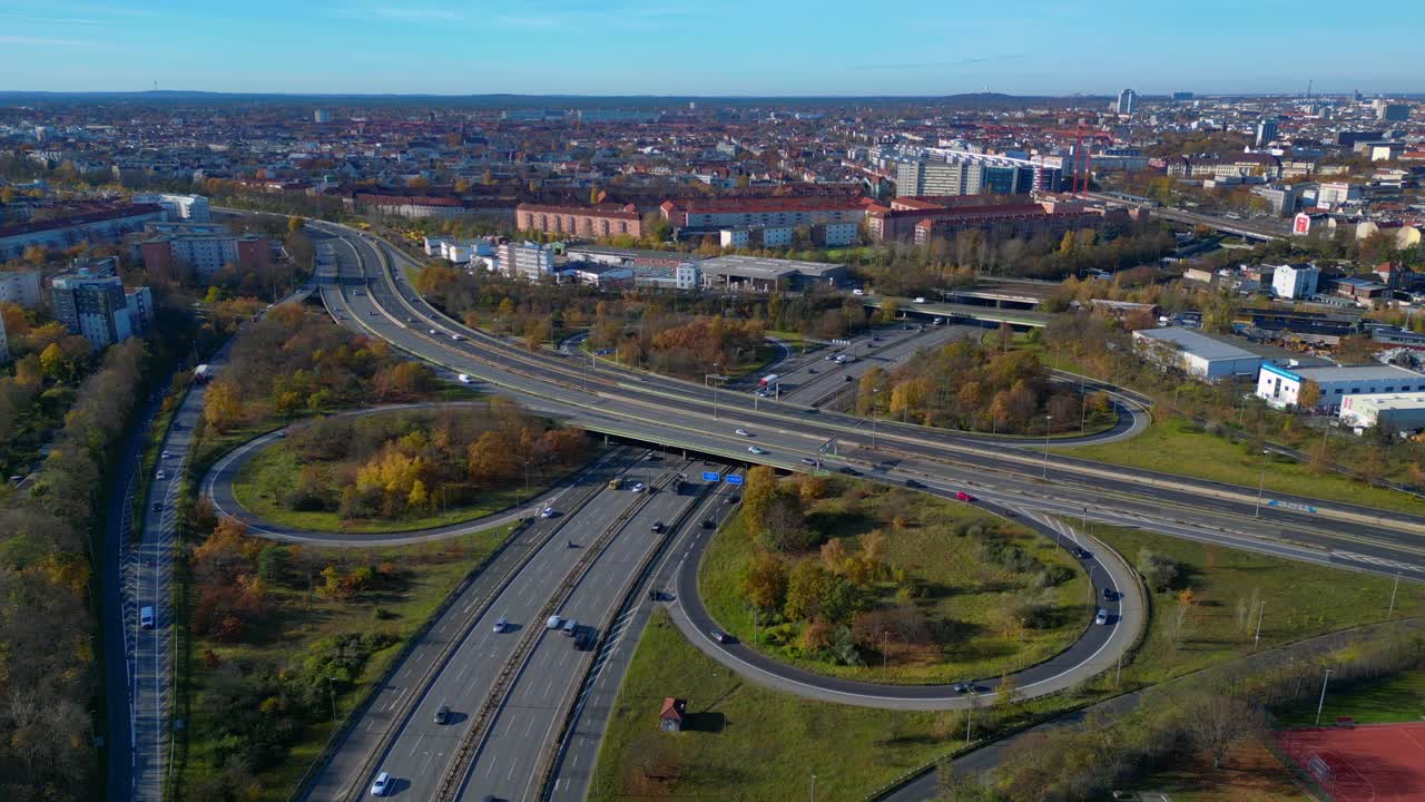 Aerial view tracking over the vast urban landscape of Berlin under a clear sky. Unique aerial view flight drone shot from above