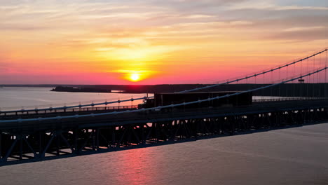 truck on a bridge at sunset