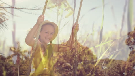 little girl playing on a swing