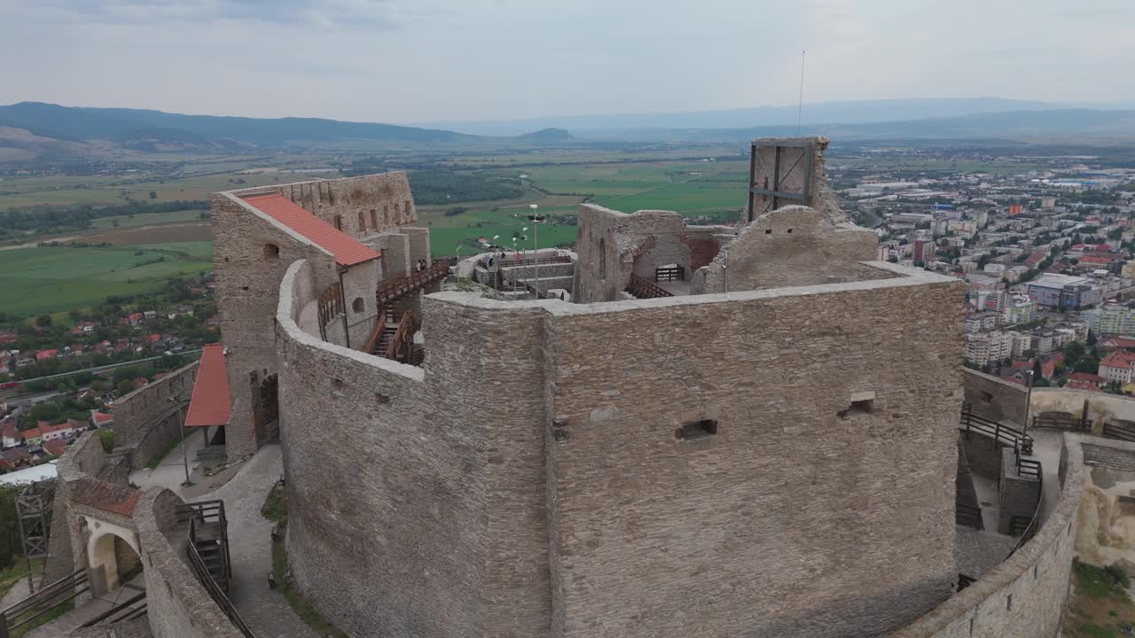 Drone orbit showcasing the architectural details and layout of the Fortress of Deva, an iconic Romanian landmark