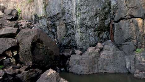 waterfall cascading over rocks into a pool