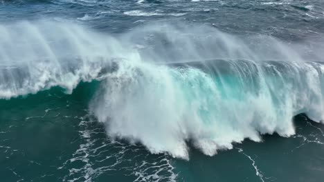 huge wave breaks in the ocean sea