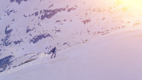 hiker in snowy mountain landscape