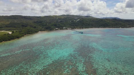 slow flying high above the island of guam in the pacific ocean