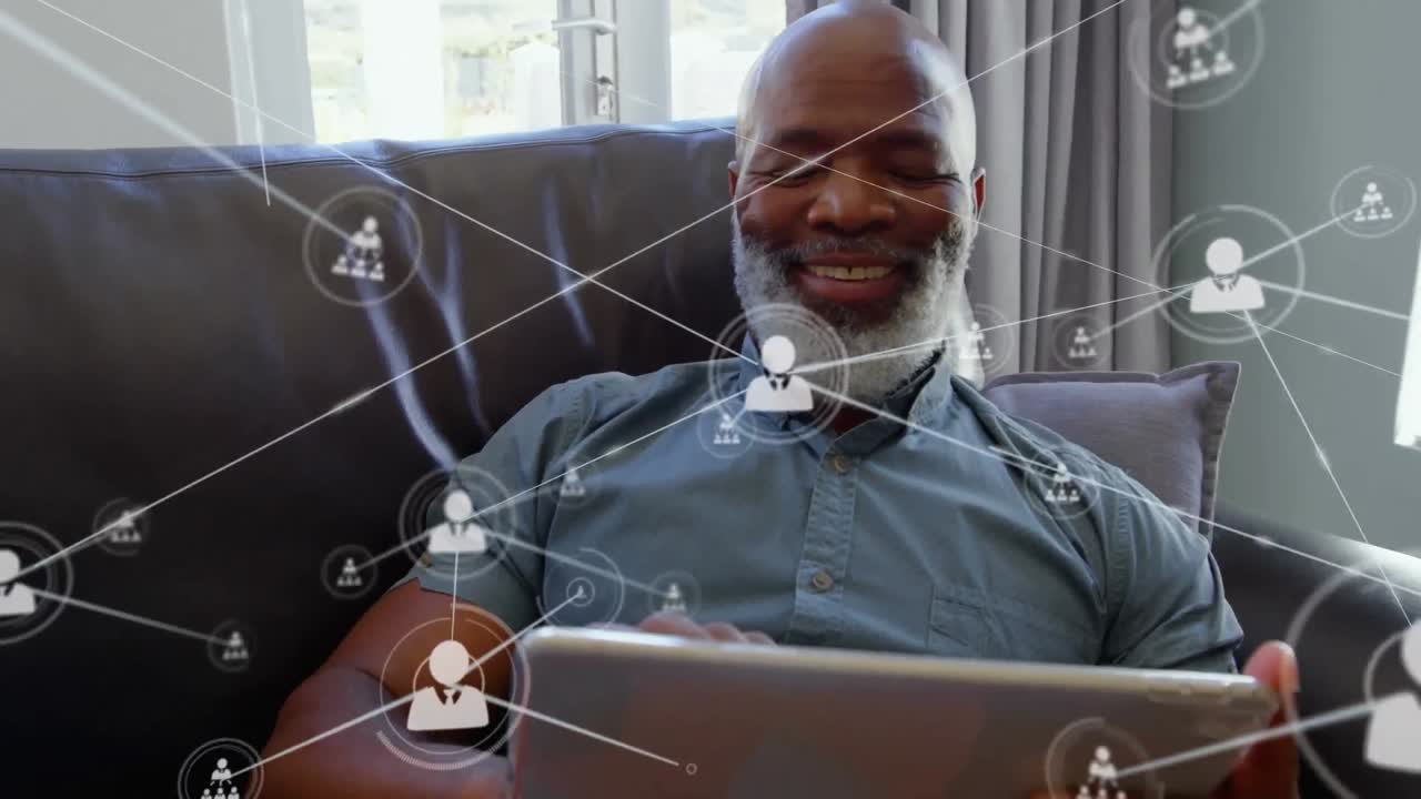 Animation of networks of connections with icons over man using tablet