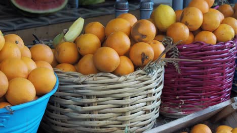 fresh oranges in wicker baskets at a market