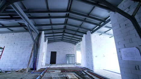 interior view of steel beams. a spacious construction site featuring steel beams and unfinished walls