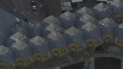 Aerial-zoom-out-shot-of-abstract-cube-houses-within-Rotterdam-city-centre,-Netherlands