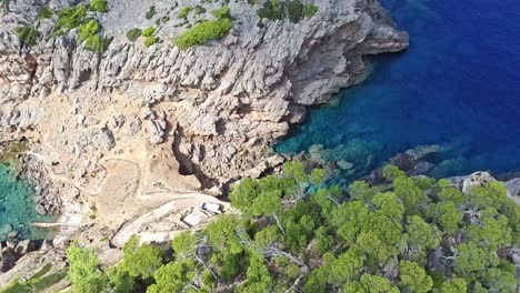 natural limestone rock erosion, coastal location, aerial dolly reveal