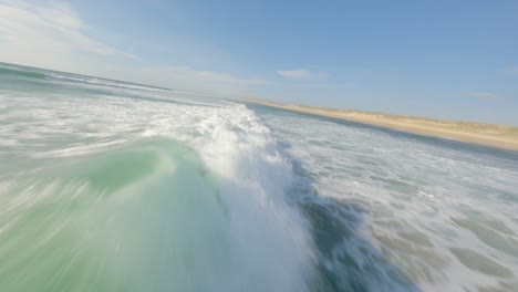 drone flying low over ocean waves foam, soustons in france