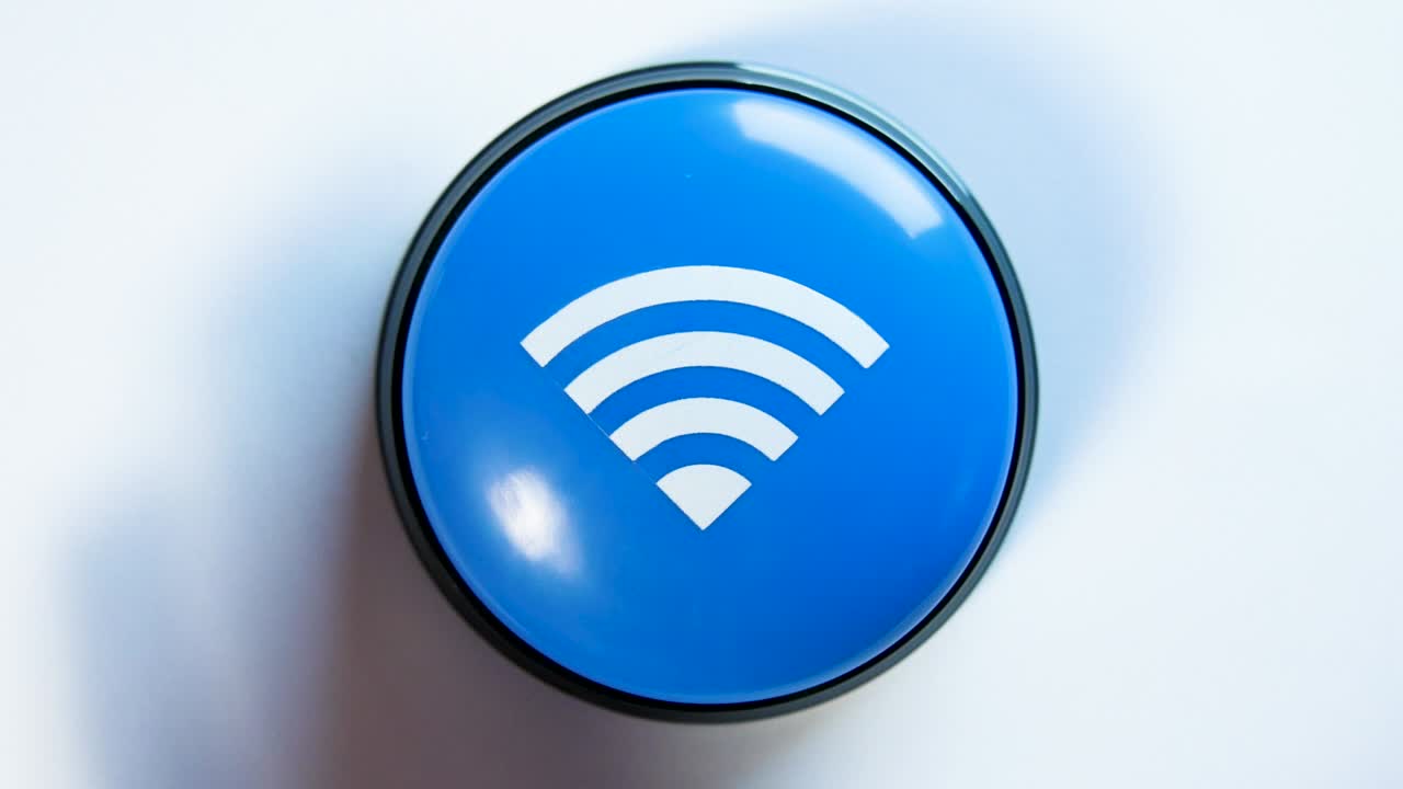 Woman turning on Wi-Fi by pushing a blue shiny button. Concept of fast wireless network connection. Using free internet in Wi-Fi zone. Button with a wave signal icon. Hotspot interface, secure network