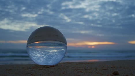 magic sunset view on the beach in a crystal ball.