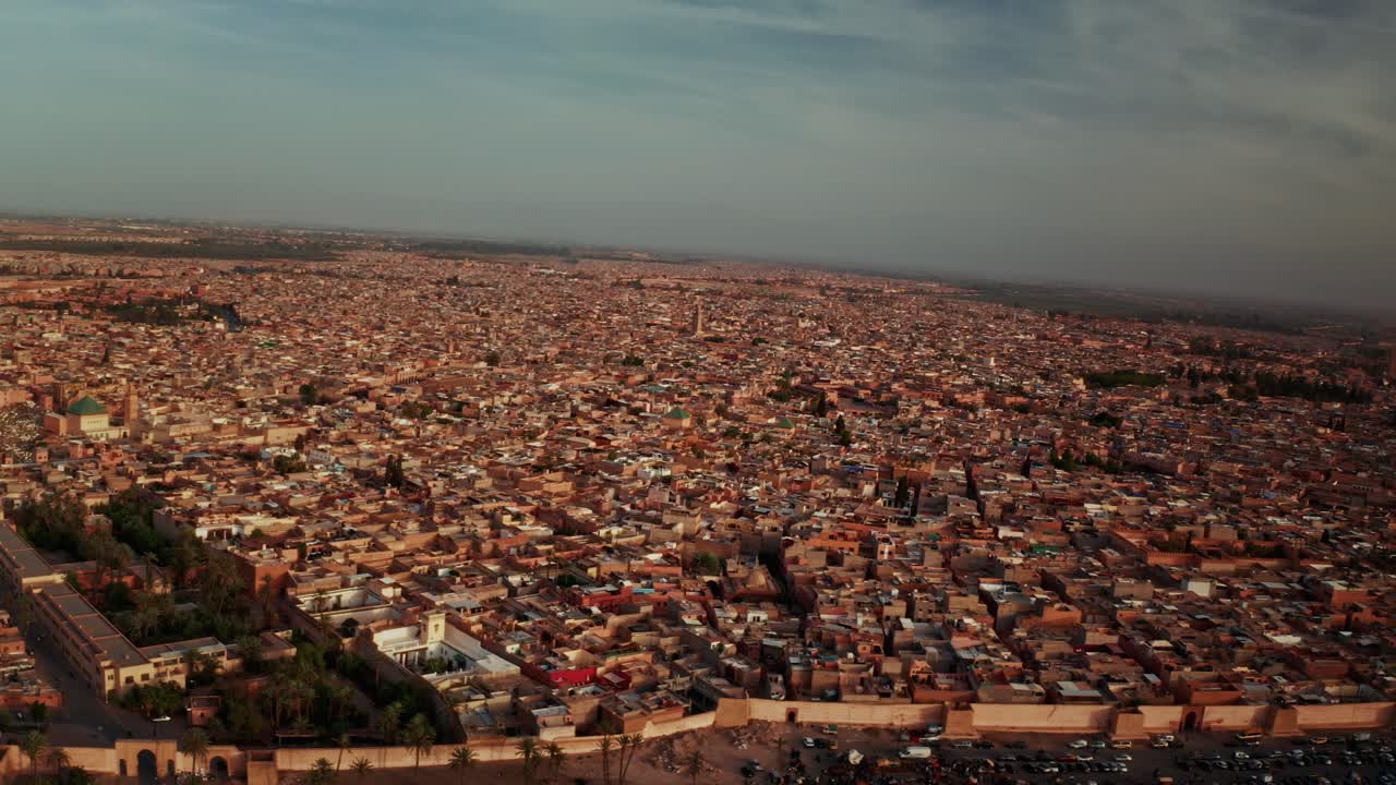 Aerial drone shot over the City of Marrakesh in Morocco. High view of the rooftops and narrow streets of Marrakesh.