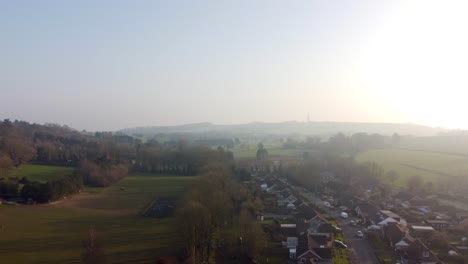 drone flight over lyminge town with blue sky