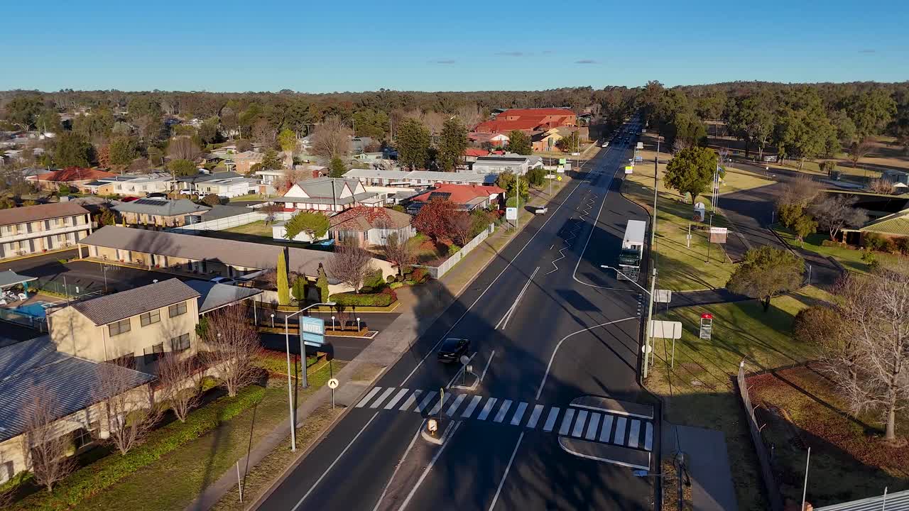 Vehicles travel through residential area in Coonabarabran, Australia