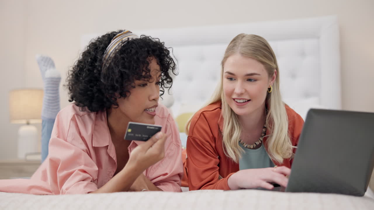 Women, credit card and friends with laptop