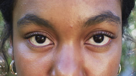 a close-up reveals a young african american woman''s eyes