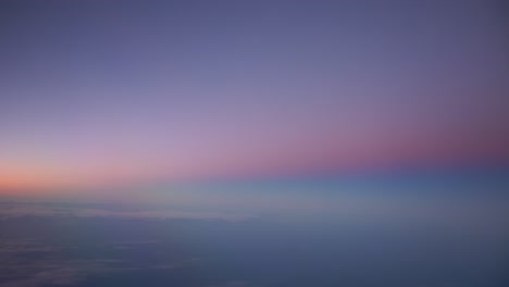 dreamlike ethereal view of sunset from aircraft window