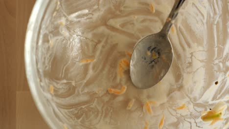 empty bowl with leftover food and spoon