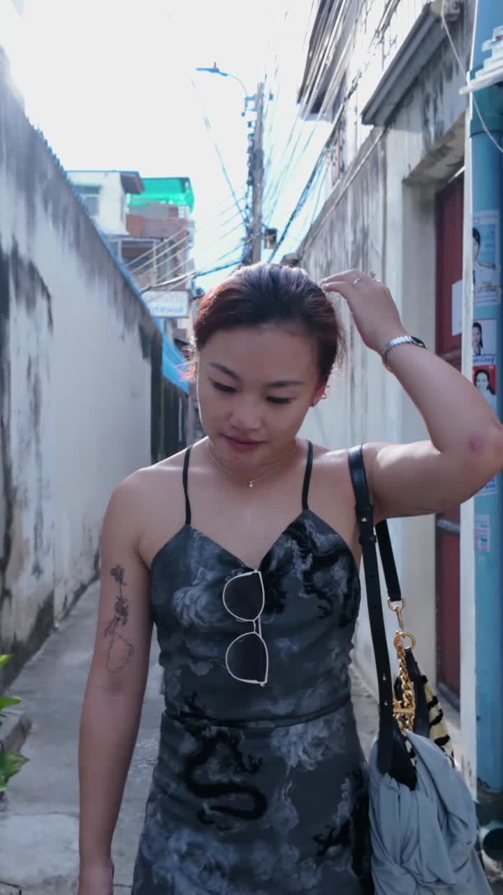 Woman walking in an alley