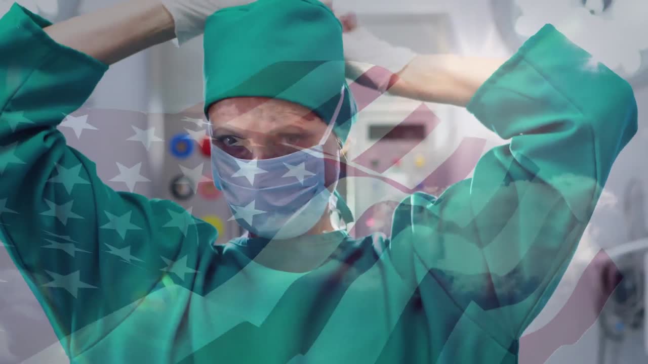 얼굴 마스크를 쓴 외과의사 위에 흔들리는 미국 국기의 애니메이션