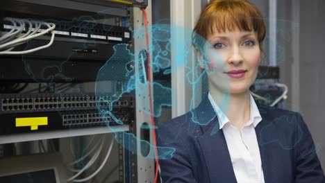 Animation-of-globe-over-caucasian-female-worker-inspecting-server-room