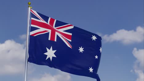 Flag-Of-Australia-Moving-In-The-Wind-With-A-Clear-Blue-Sky-In-The-Background,-Clouds-Slowly-Moving,-Flagpole,-Slow-Motion