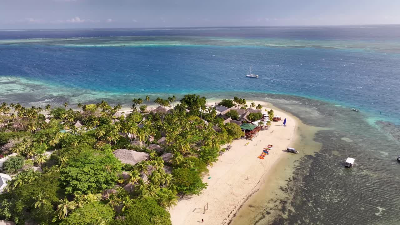 Amazing aerial of Qualito Island with resort and tropical paradise getaway holiday spot in Fiji.