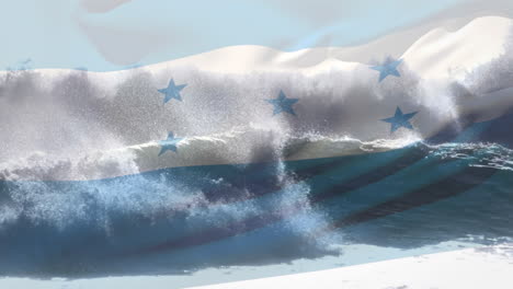 digital composition of honduras flag waving against aerial view of waves in the sea