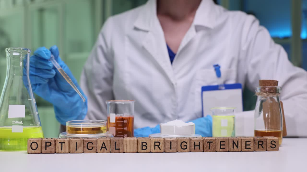 Laboratory worker carefully transfers liquid into petri dish