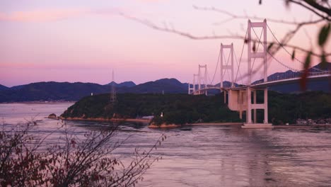 kurushima kaikyo bridge at sunset, beautiful vibrant autumn colours of japan