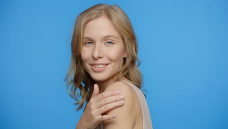 happy woman applying skincare