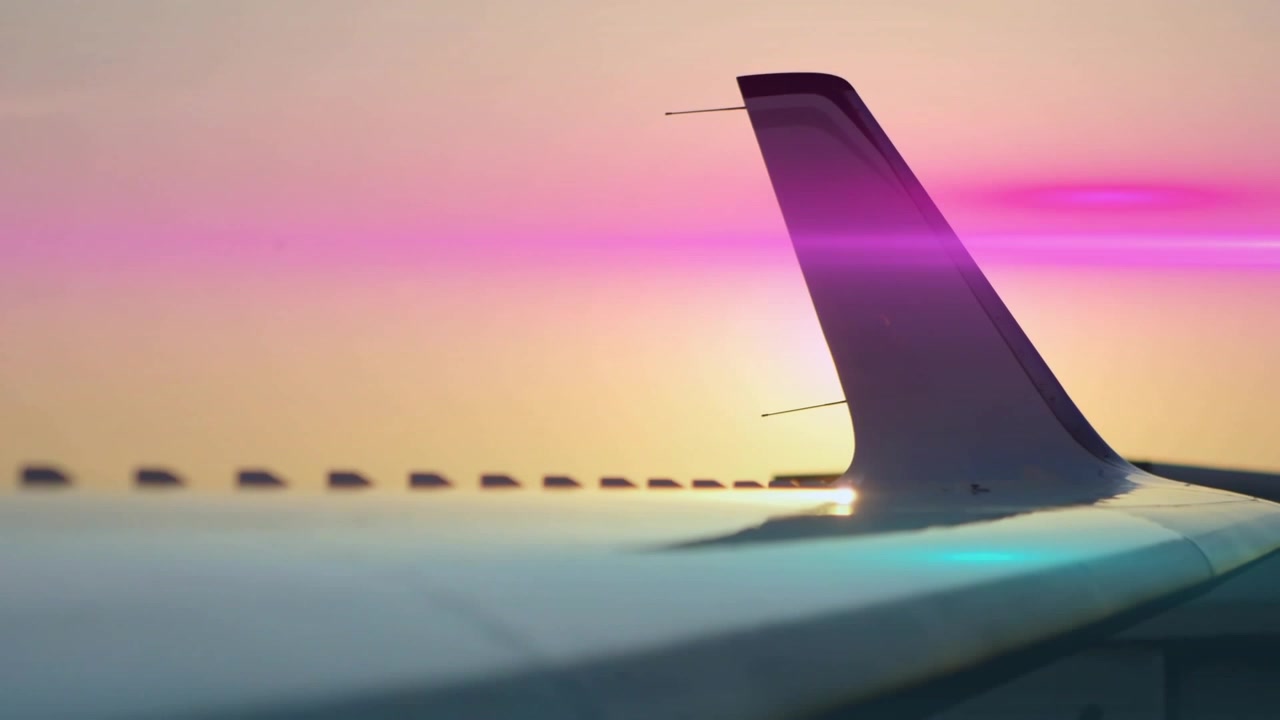 Sun peeking behind winglet, creating lens flares evolving into cyan magenta streaks over pastel sky