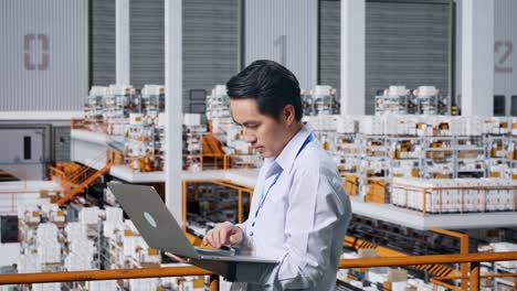 warehouse worker using laptop