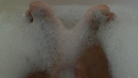 feet getting soak before the treatment. close up