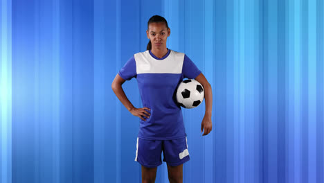 female soccer player against abstract blue background