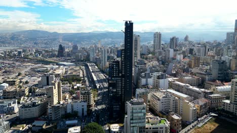 drone shot panning right across beirut city skyline with skyscrapers