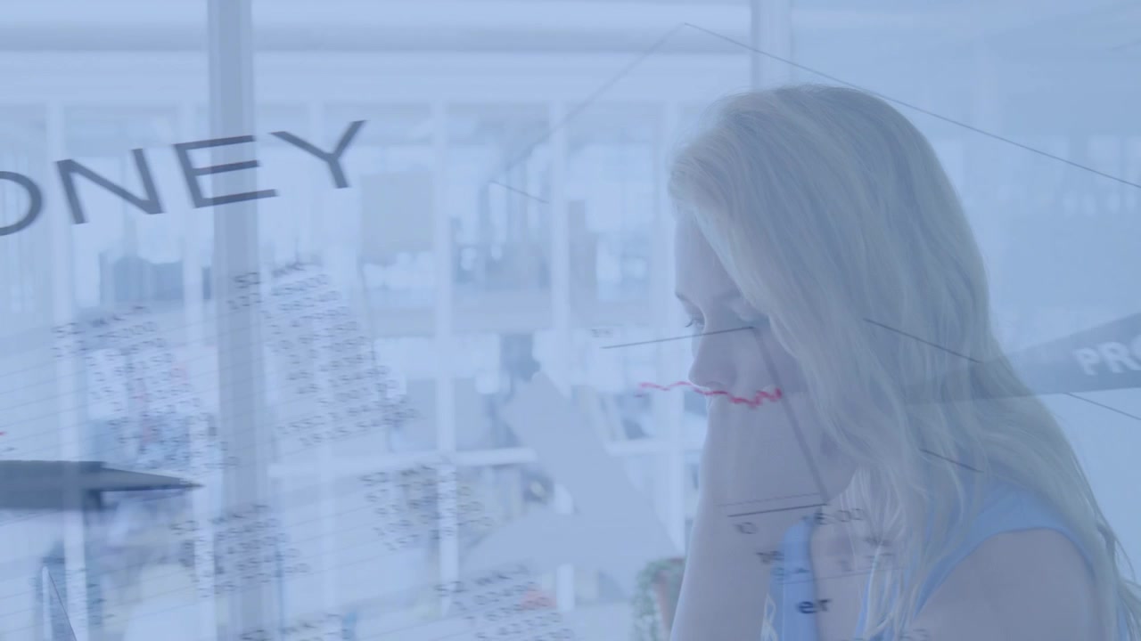 Overlaid money charts appearing, woman holding device, shifting gaze and studying to analyze profit