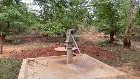 an old hand pump in a village in india