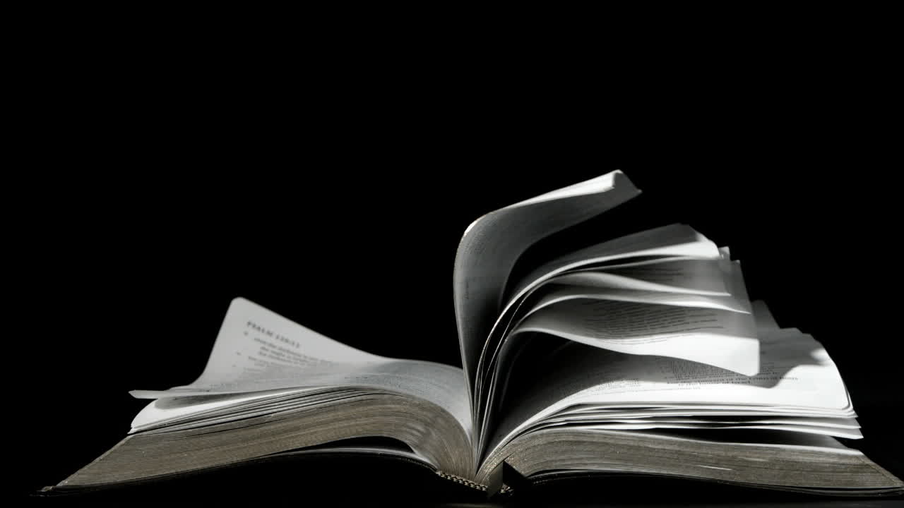Pages of the bible turning in the wind