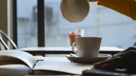 Woman-preparing-coffee-in-cafe-4k