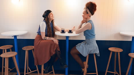 friends, women and conversation at coffee shop