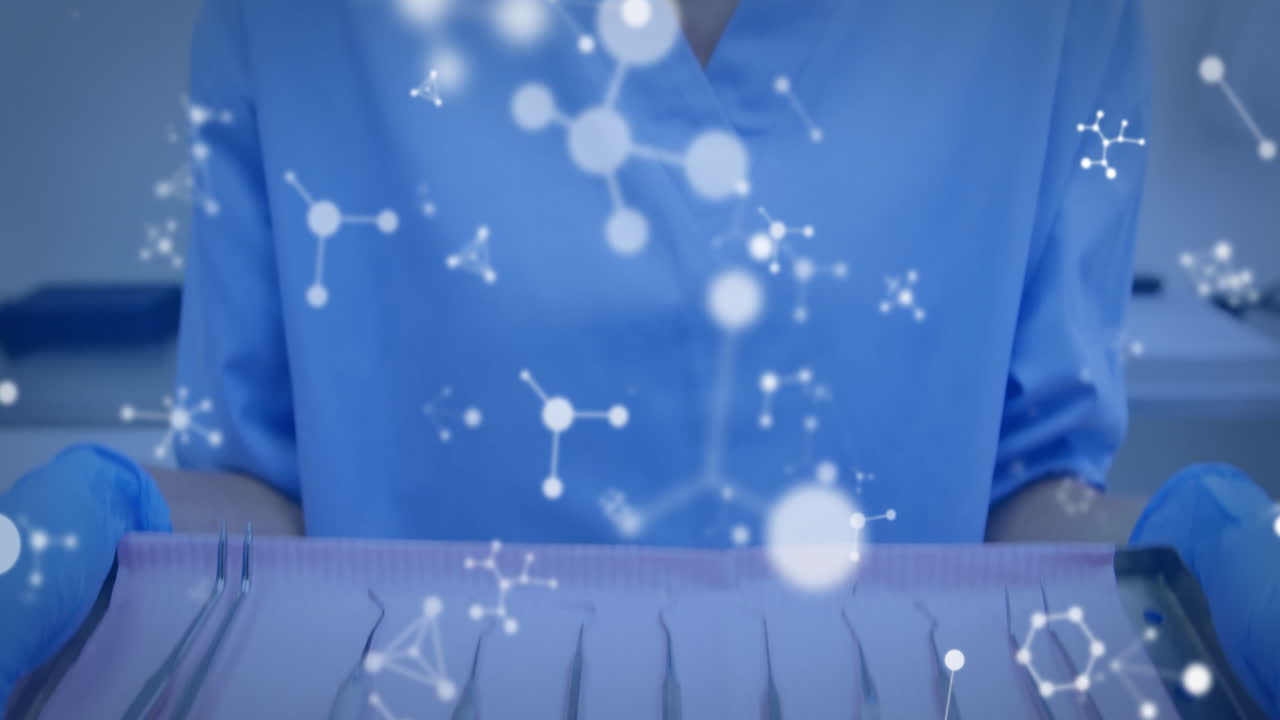 Animation of molecules over caucasian female dentist holding tools