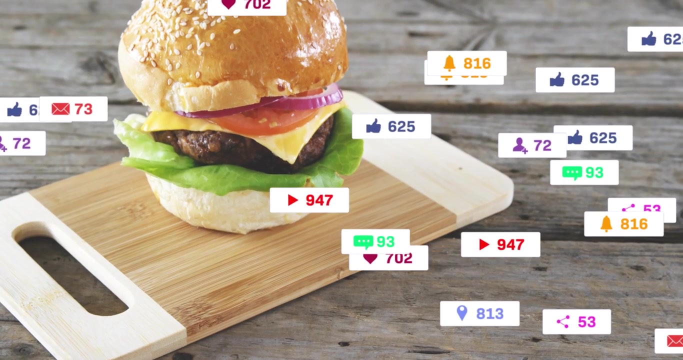 Bamboo board sliding in, burger building, animated heart icons orbiting then fading marketing
