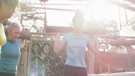 Female-friends-enjoying-exercising-at-boot-camp-together