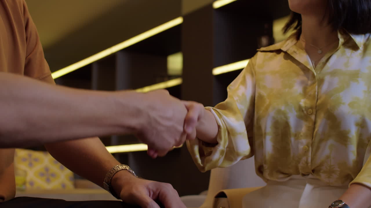 Unrecognizable Business Colleagues Giving Each Other Handshake